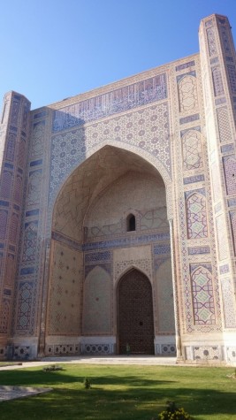 Tiny Cindy standing in front of huge mosque